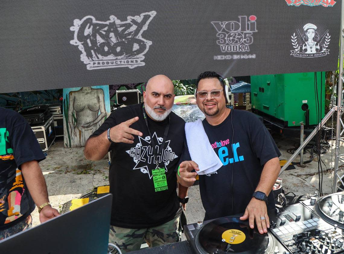 Eric Narciandi (left)) a.k.a. DJ EFN poses with DJ Klassik, during an event to celebrate the Crazy Hood Productions 30th anniversary at La esquina de la Abuela space in Miami, on December 02, 2023.