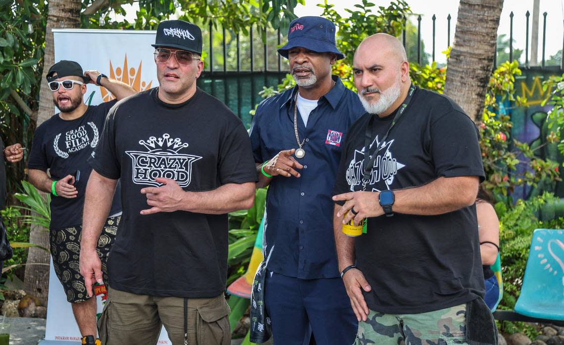 Eric Narciandi (far right) a.k.a. DJ EFN poses with Miami legend rapper JT Money (center and Charles Rivero, during an event to celebrate the Crazy Hood Productions 30th anniversary at La esquina de la Abuela space in Miami, on December 02, 2023.