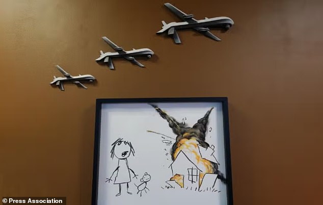 The drones resemble those on another artwork, Civilian Drone Strike, which depicted them destroying a house while a little girl and her dog watch on in horror