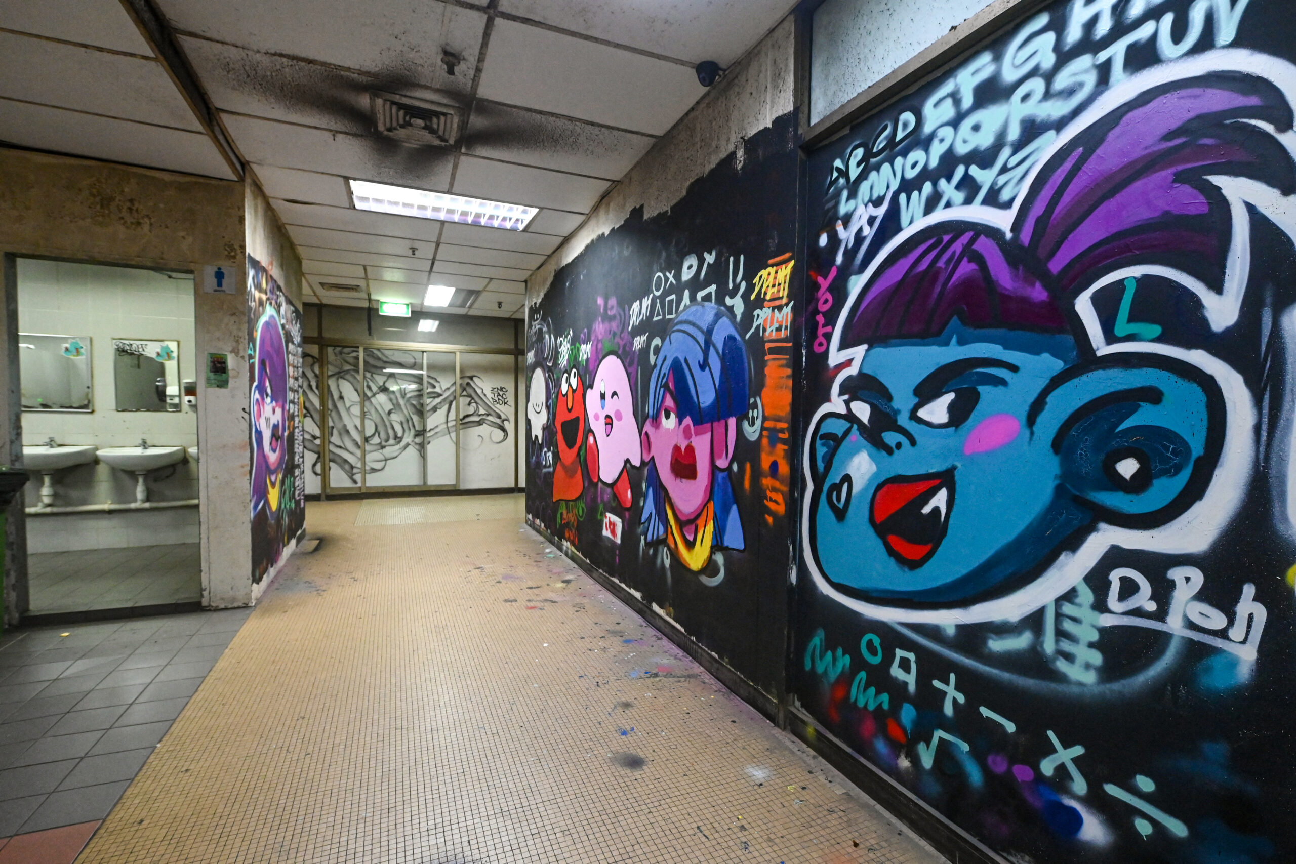 Bathroom walls and mirrors are also splattered with graffiti