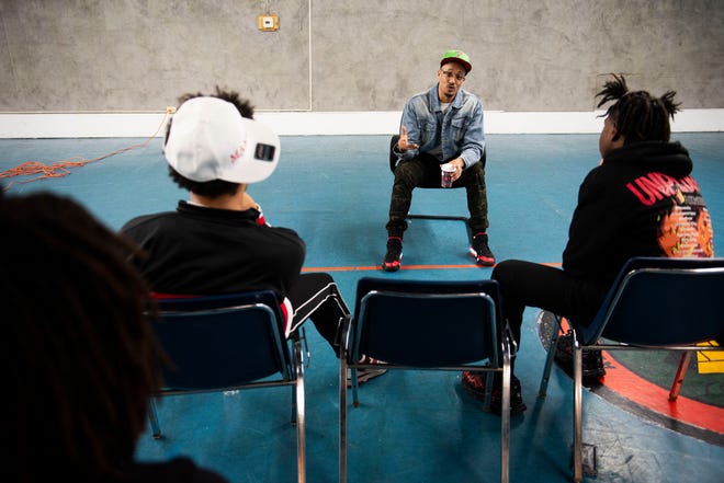 Filmmaker Amadeuz Christ, center, shares his personal journey while leading a workshop about filmmaking during Dilla Family Day at the Alkebu-lan Village on Saturday, Feb. 10, 2024 in Detroit. The event featured roller skating, educational workshops and a pizza lunch.