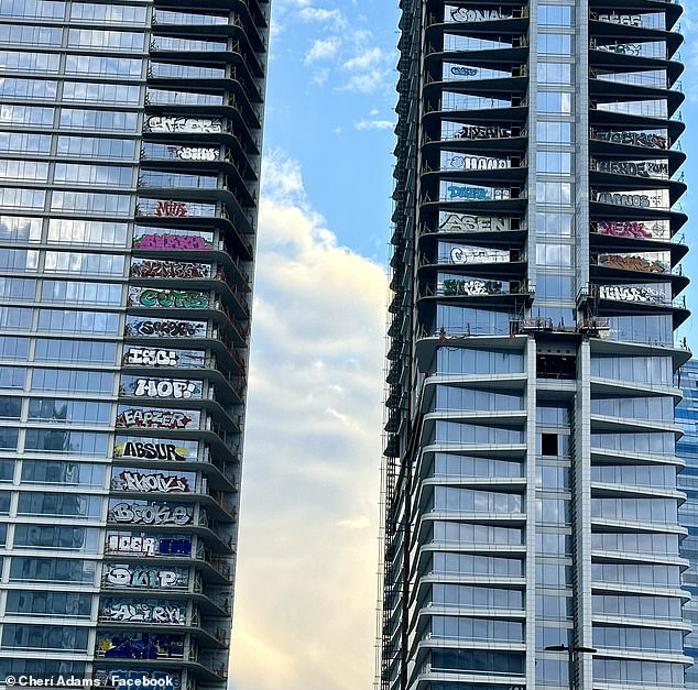 The graffiti artists have covered 27 floors of Oceanwide Plaza, a deserted three-building project owned by Oceanwide Holdings, with colorful tags