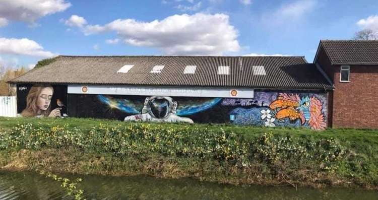 The mural on the Westons Farm Supplies building before it was tagged