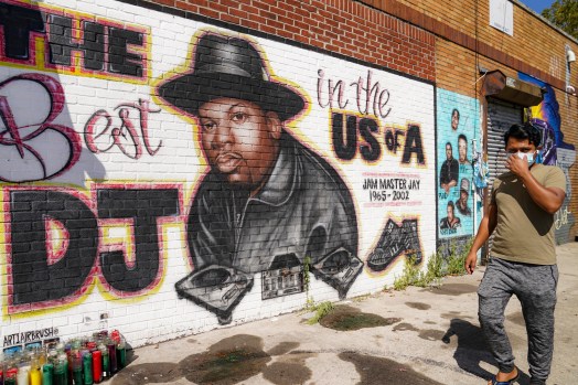 File photo: A pedestrian passes a mural of rap pioneer Jam Master Jay of Run-DMC, by artist Art1Airbrush, Aug. 18, 2020, in the Queens borough of New York. File photo: A pedestrian passes a mural of rap pioneer Jam Master Jay of Run-DMC, by artist Art1Airbrush, Aug. 18, 2020, in the Queens borough of New York.