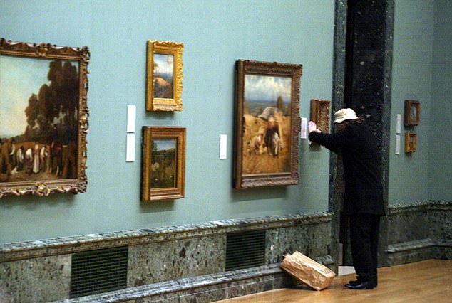 An artist believed to be Banksy was seen putting up a creation at the Tate Britain in 2003