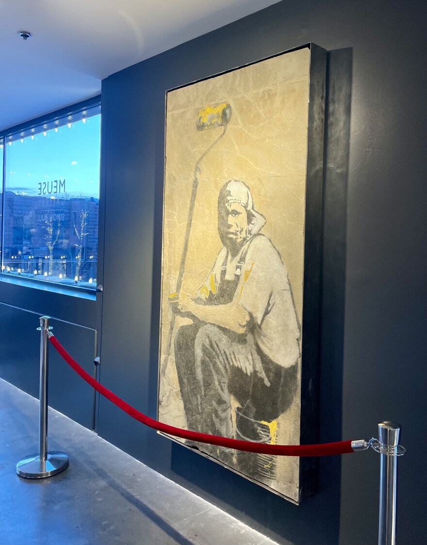 A wall of Banksy graffiti — removed from the building it was painted on so it could be preserved — hangs at the Meuse Gallery in downtown Aspen. It’s part of an exhibition that explores the process of reclaiming and restoring works of street art.
