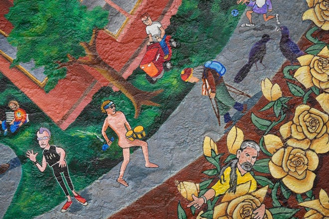 Detail of the “Austintatious” mural by Kerry Awn, Tom Bauman and Rick Turner which they originally painted as University of Texas art students in 1973, on the north wall of the University Co-Op Monday April 1, 2024.