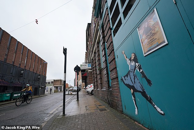 The painting of Dorothy has appeared on the side of the Sidewalk bar in the city's Gay Village in Kent Street and has 'all the hallmarks of Banksy'