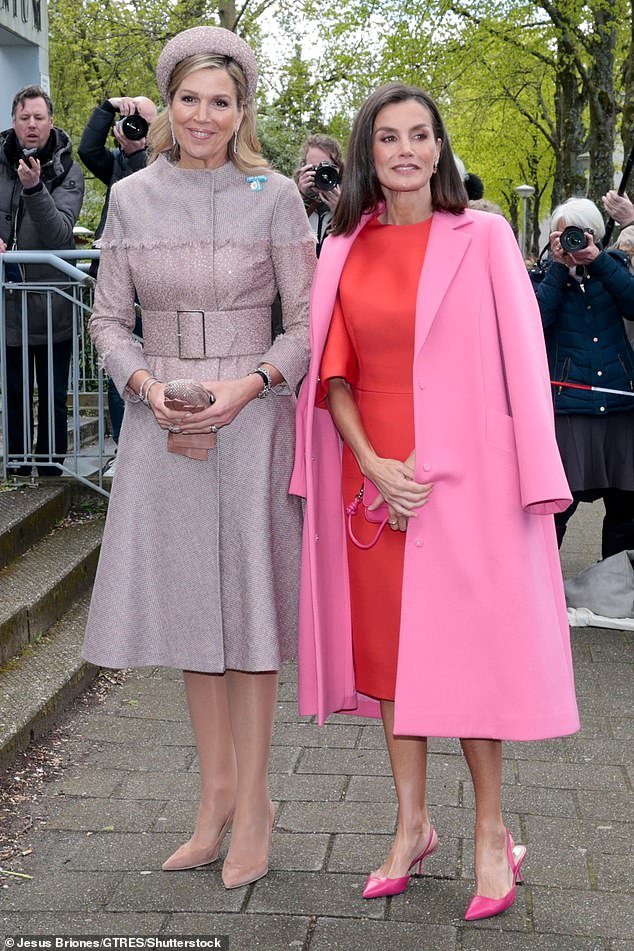 Queen Maxima (L) and Queen Letizia (R) looked stunning in coordinated pink outfits in Amsterdam today