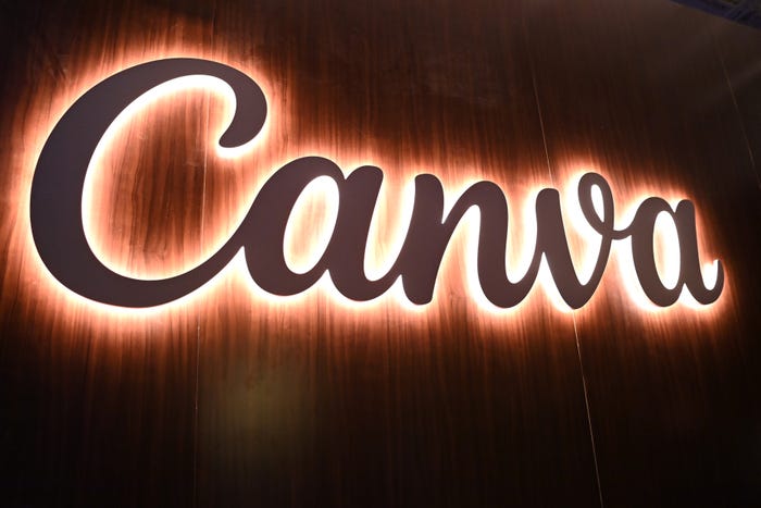 Canva logo display on a wall lit up