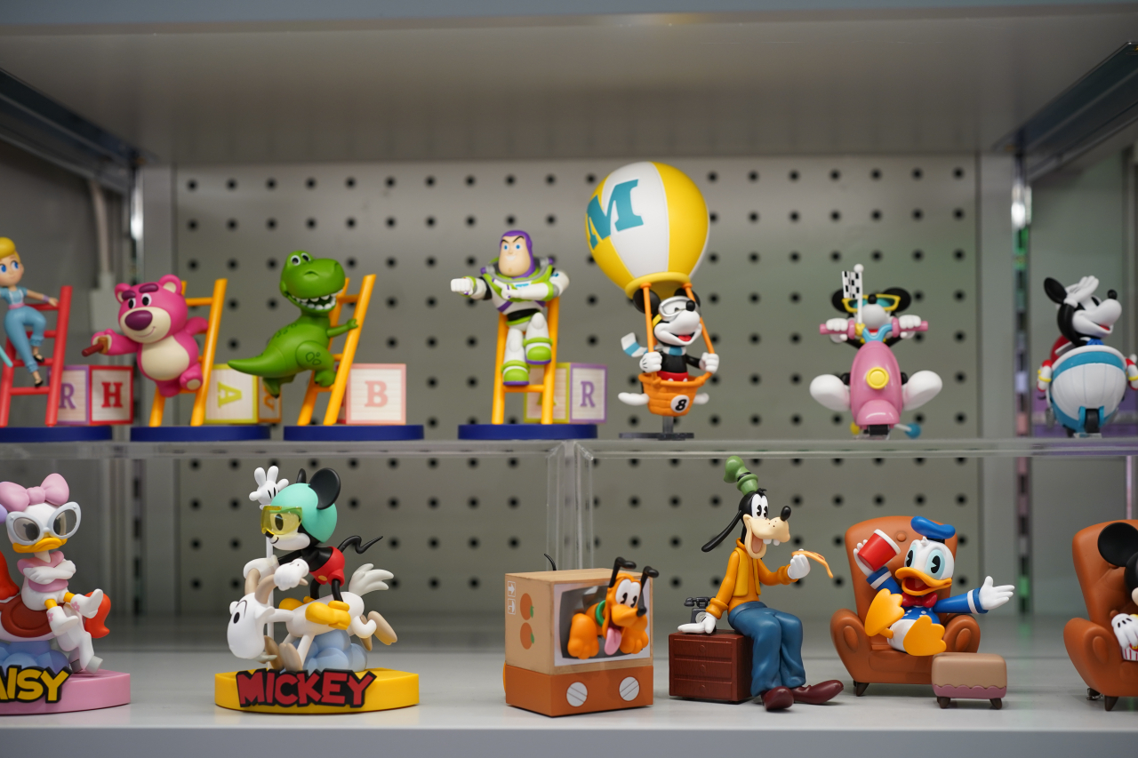 Disney toys and figurines are displayed at Play In The Box. (Lee Si-jin/The Korea Herald)