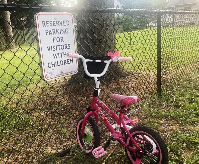 A child's bike seems appropriately parked at Lion's Den playground in Cherry Hill.
