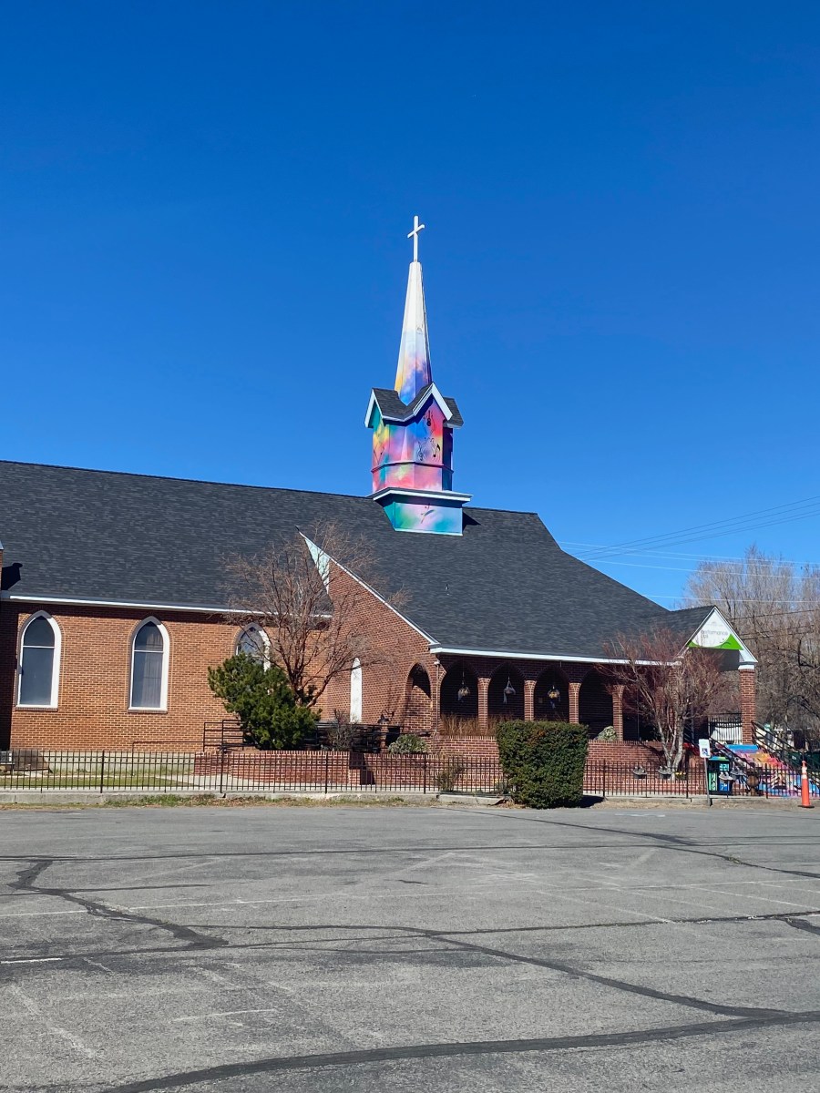 Nevada murals. Image is a spire on modern church that is painted in vibrant colours