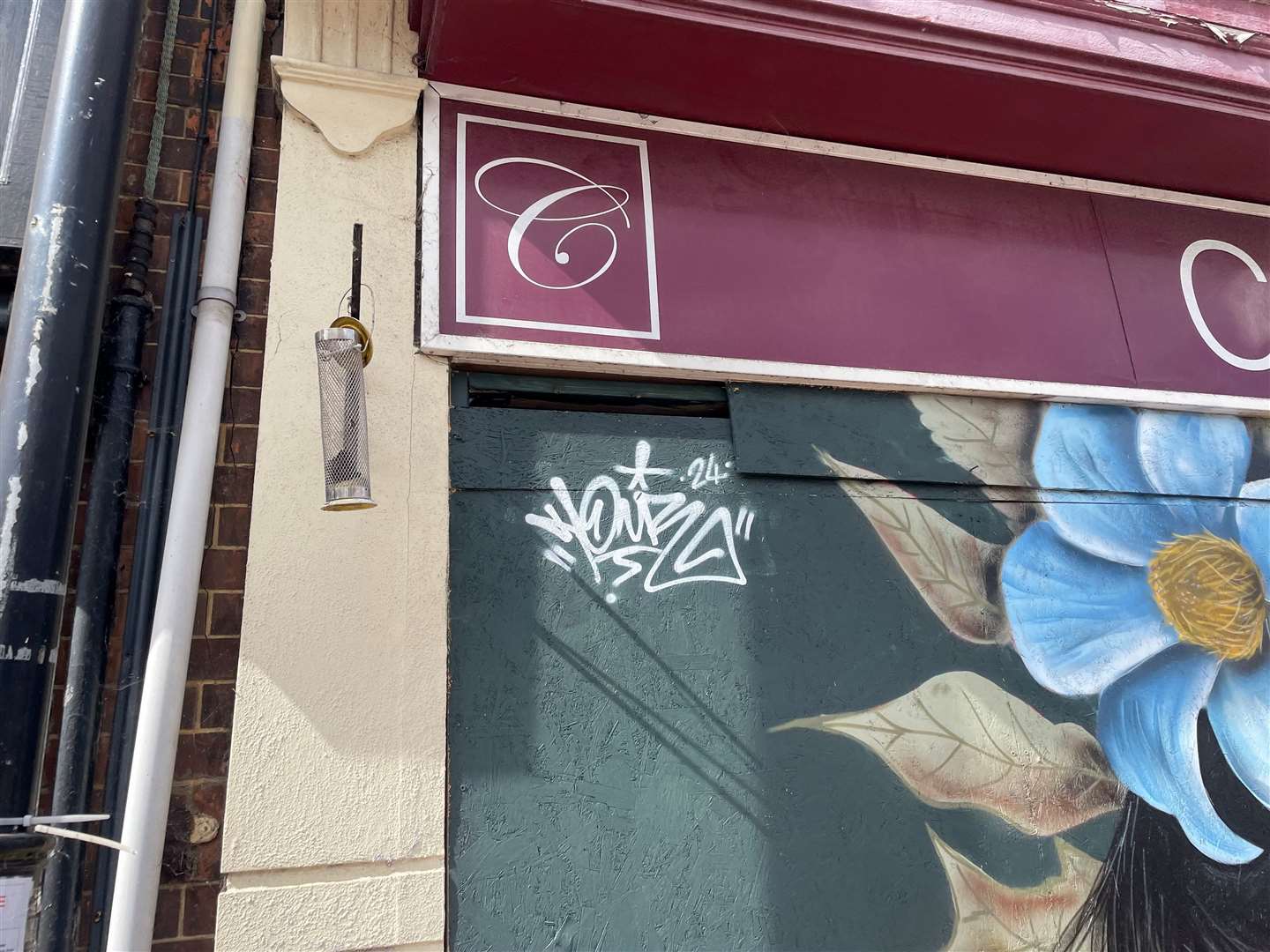 A tag has appeared in the corner of the mural