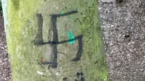 Mike Langman Tree with swastika