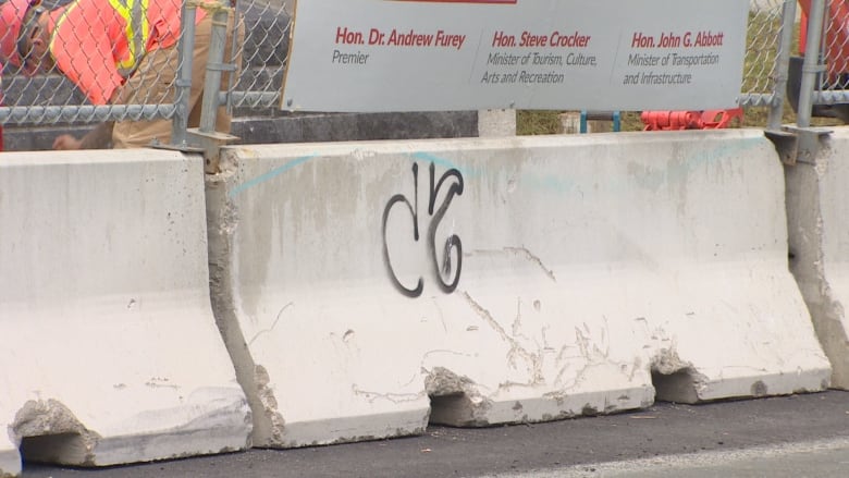 graffiti on a concrete barrier at the war memorial in St. John's.