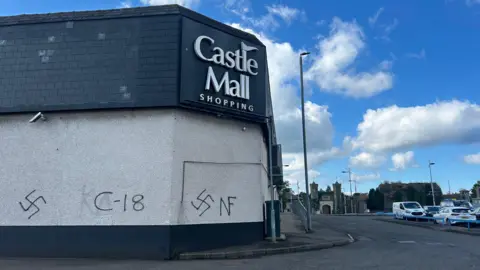 Swastikas and C-18 graffiti on Antrim's Castle Mall