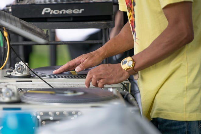 DJ Gravity works the turntables during the second annual Hip-Hop Festival at Mineral Palace Park on Saturday, July 20, 2024.