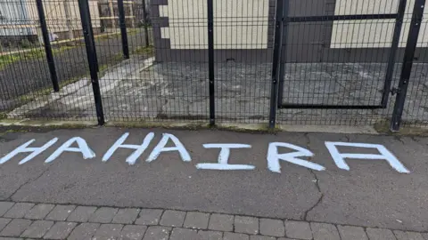 Rasharkin Loyal Orange Lodge  The words 'HAHA IRA' painted on the pavement outside the Orange Hall