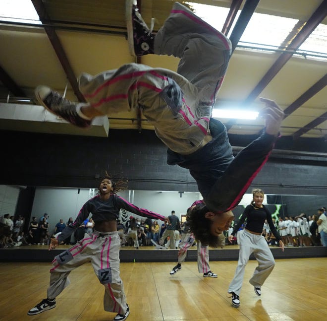 Isaiah Wilson (center) performs a flip with the Legendz dance team during a performance for friends and family as the team practices for the Hip Hop International's World Hip Hop Dance Championship Aug. 1, 2024, in Mesa, Arizona.