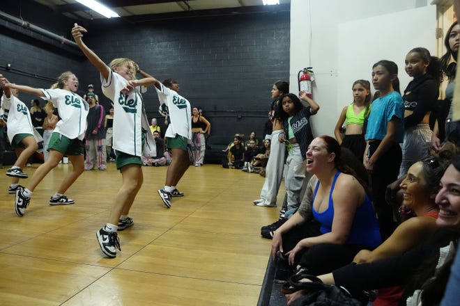 Parents, siblings and friends cheer on Elektro Crew during a performance for friends and family as the team practices for the Hip Hop International's World Hip Hop Dance Championship Aug. 1, 2024 in Mesa, Arizona.