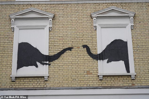 The artwork showing two elephants poking their heads out of blocked out windows in Chelsea