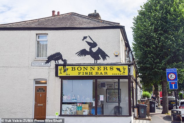 Banksy's fifth painting of two pelicans eating fish appeared in Walthamstow this morning