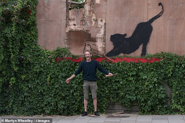 A man has already been spotted trying to nab Banksy's latest artwork, less than an hour after it was unveiled