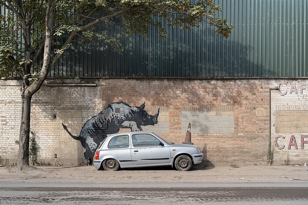 The elusive street artist posted a picture of his mural to his official Instagram showing a rhino mounting a Nissan Micra with a traffic cone on its bonnet on Westmore Street in Charlton, south-east London