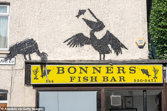 The pelicans appeared above Bonners Fish Bar in Walthamstow, north-east London, last Friday