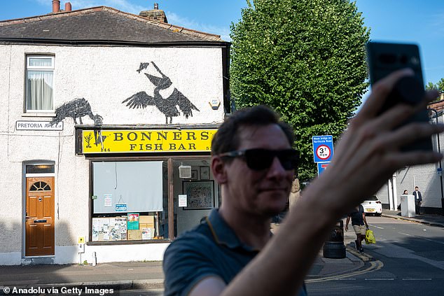 Banksy fans have been gathering outside the takeaway in Walthamstow, north-east London