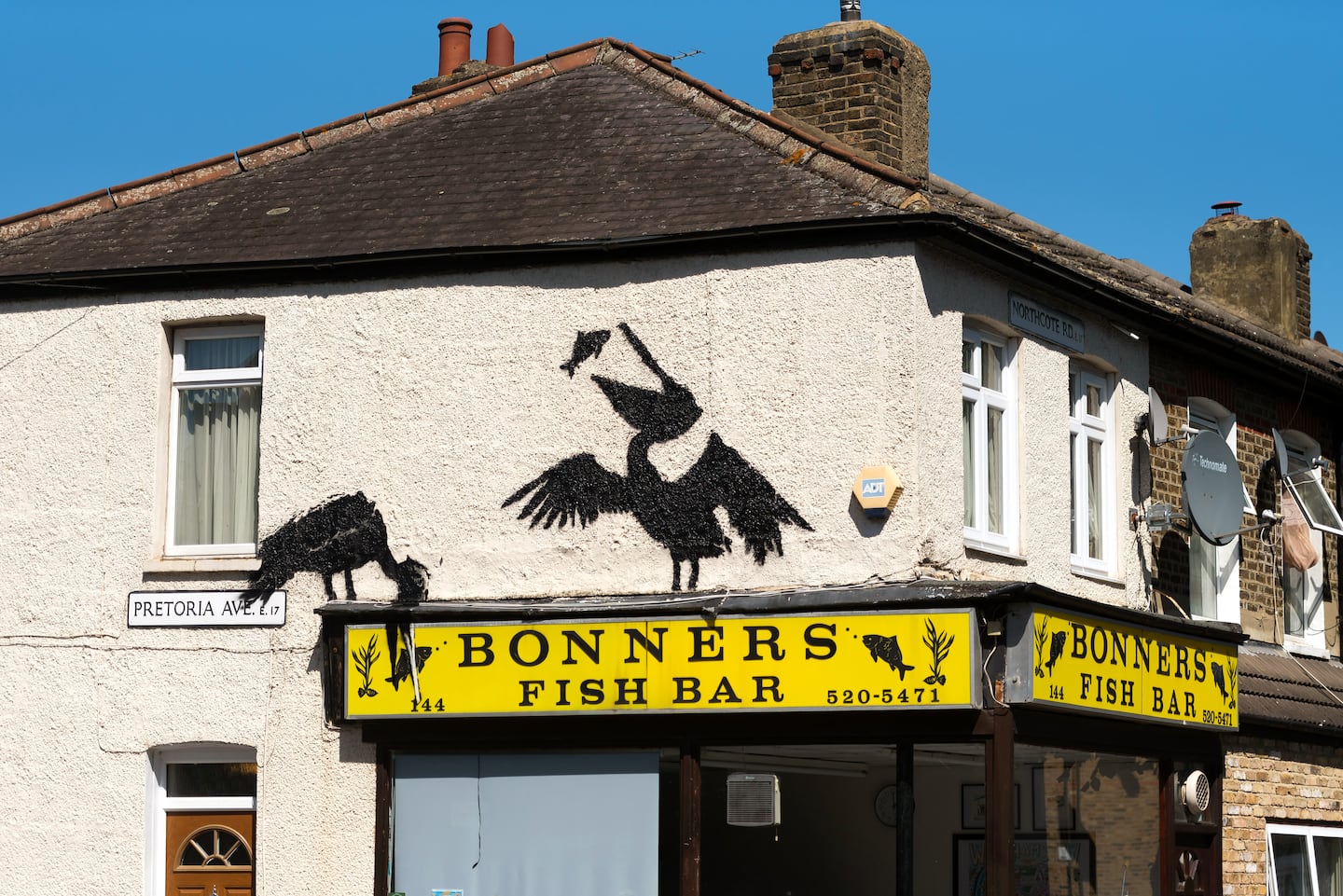 A mural purportedly by the artist Banksy, showing pelicans eating fish, adorns the side of Bonners fish and chip shop on August 09, 2024 in Walthamstow, England.