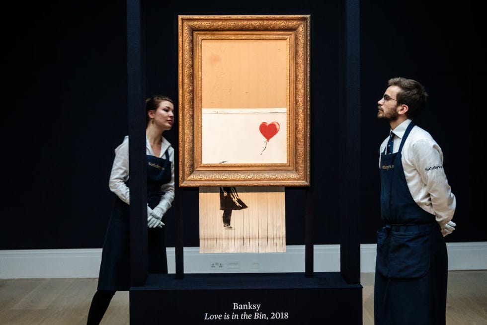 sotheby's unveils banksy's newly completed artwork 'love in in the bin'