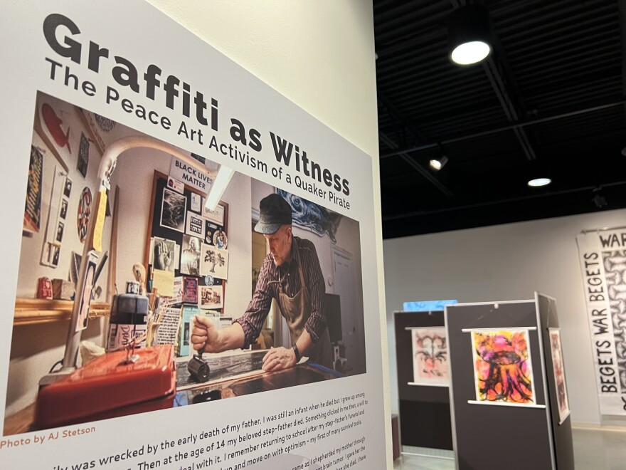 A photo of Todd Drake, the Quaker Pirate, hangs at the entrance of his exhibit at Wilmington College's Quaker Heritage Center.