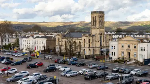 Getty Images View of a church and car park in Cheltenham from above