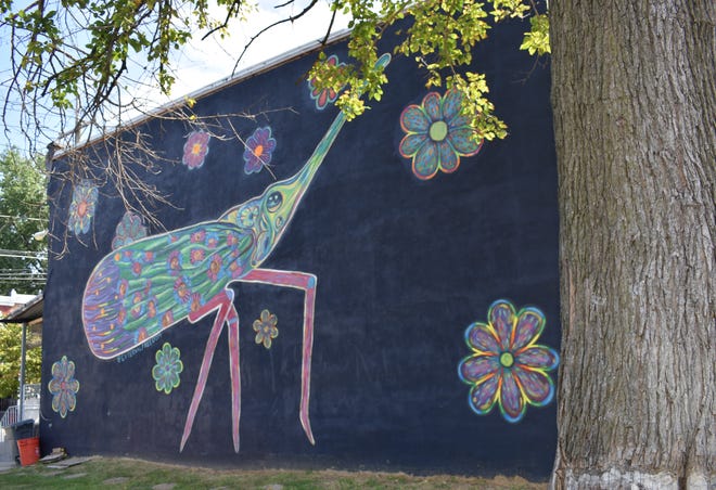 An exterminator might be unnerved by this creature on a wall on the 500 block of Erie Street.