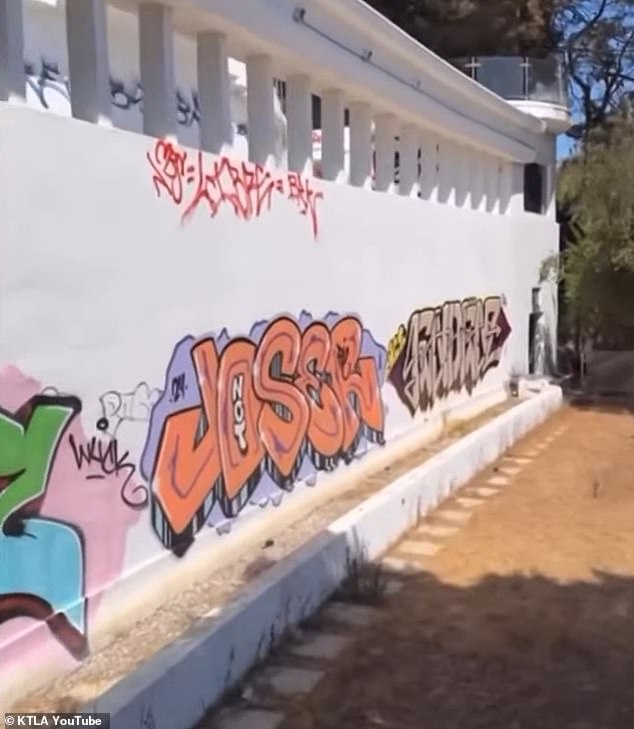 The gorgeous white and glass home - that used to belong to singer Mary J. Blige - is now covered in rainbow art from words, to a crying dead heart, to faces