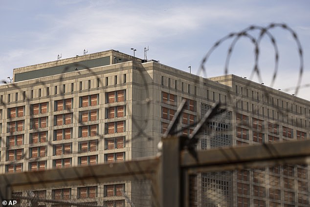 The Metropolitan Detention Center is seen through barbed wire in the Sunset Park neighborhood of the Brooklyn borough of New York