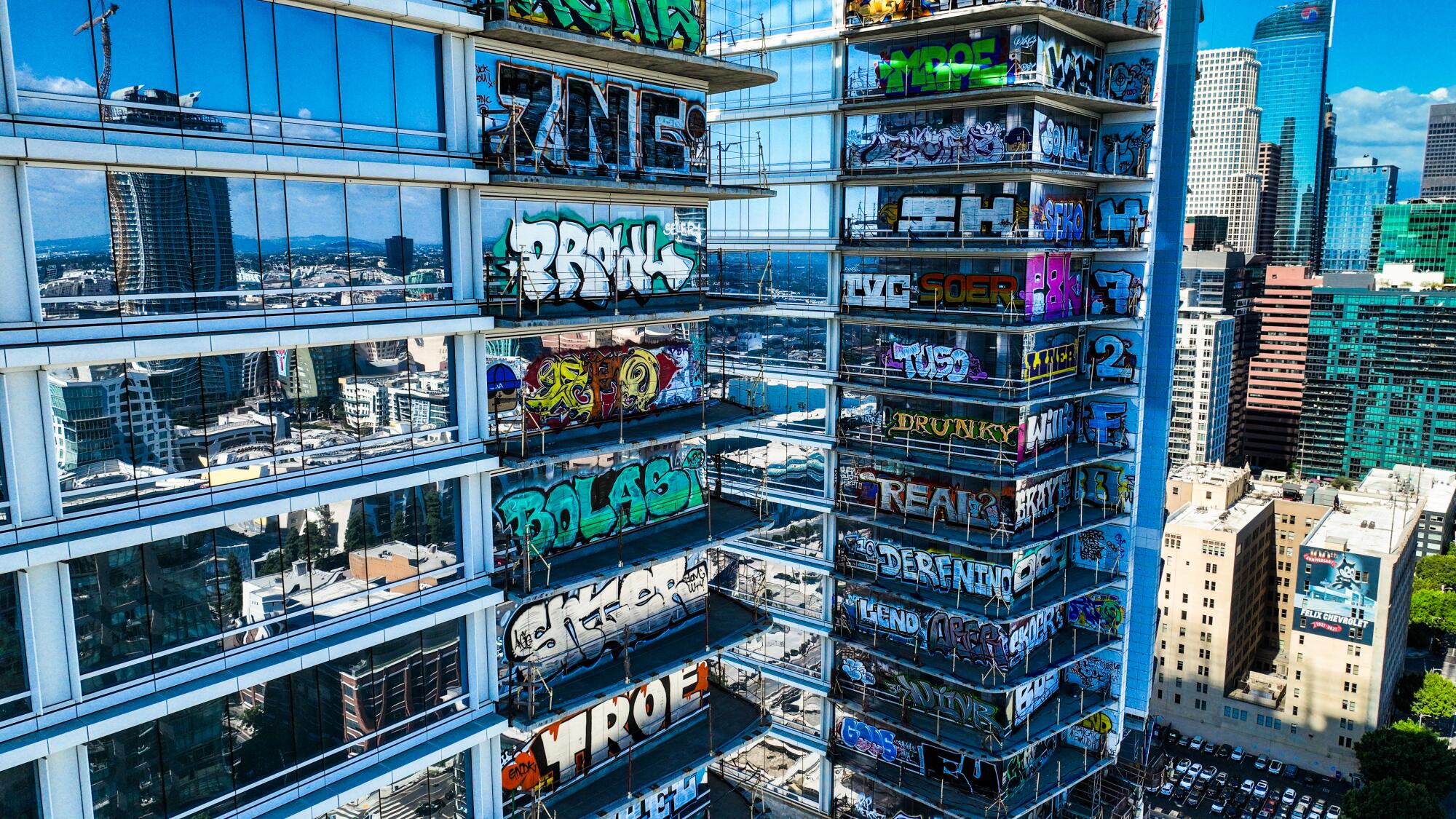 Graffiti covers many floors of two high-rises.