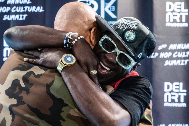 Headliner Flavor Flav hugs Hakim Green at the second Hip Hop Cultural Summit at the Delaware Art Museum in Wilmington, Saturday, Oct. 27, 2024.