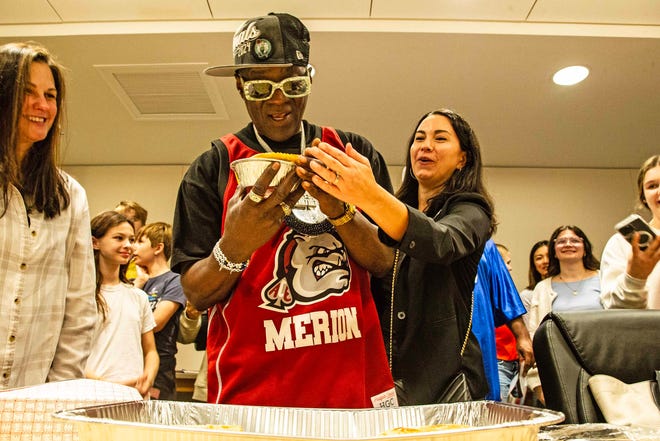 From left, Headliner Flavor Flav and Molly Giordano have a laugh at the second Hip Hop Cultural Summit at the Delaware Art Museum in Wilmington, Saturday, Oct. 27, 2024.