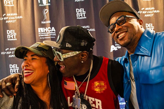 From left, CEO of One Village Alliance, Chandra Potts, Headliner Flavor Flav and Grouchy Greg are featured at the second Hip Hop Cultural Summit at the Delaware Art Museum in Wilmington, Saturday, Oct. 26 2024.