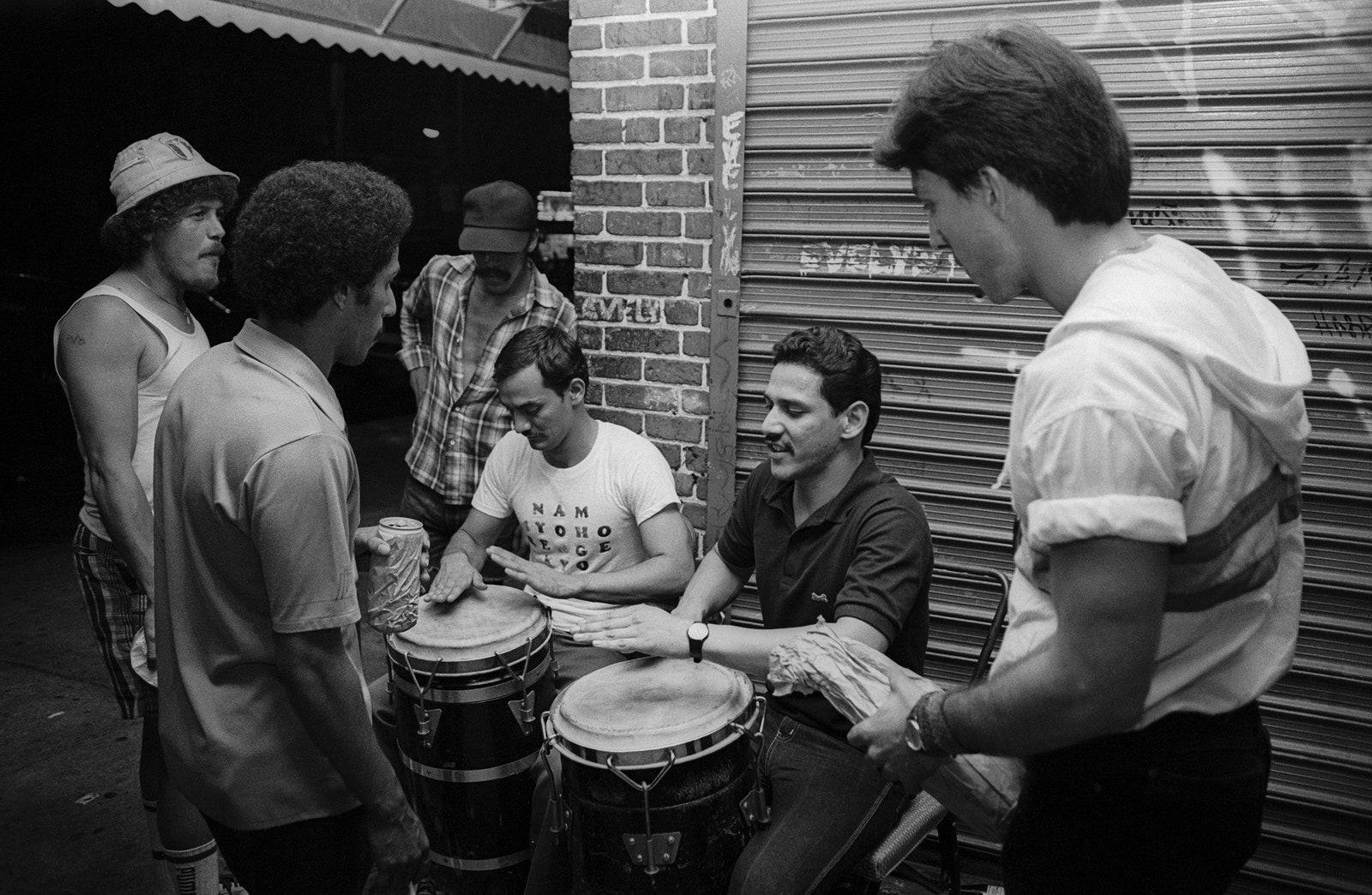 Men playing conga drums.