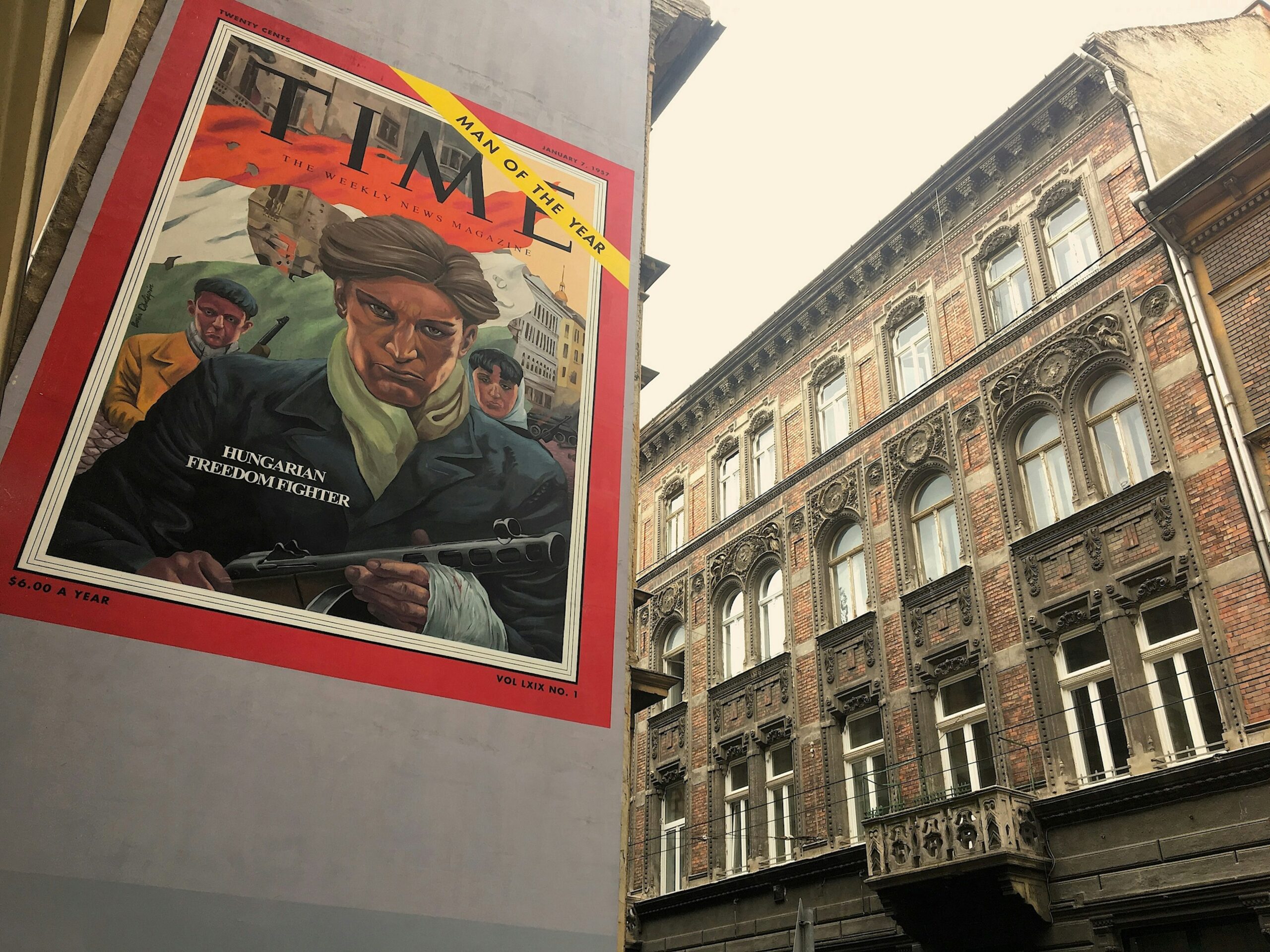 A mural of the cover of Time magazine showing armed people with the words 'Hungarian Freedom Fighter' written across it.