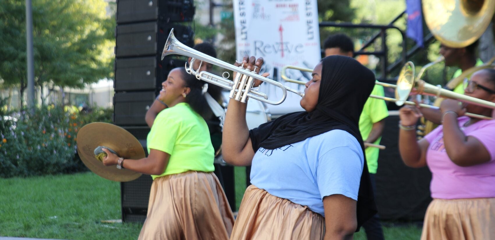 women playing brass instruments