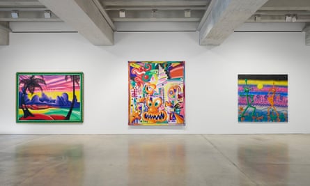 three colourful paintings on the wall of a gallery