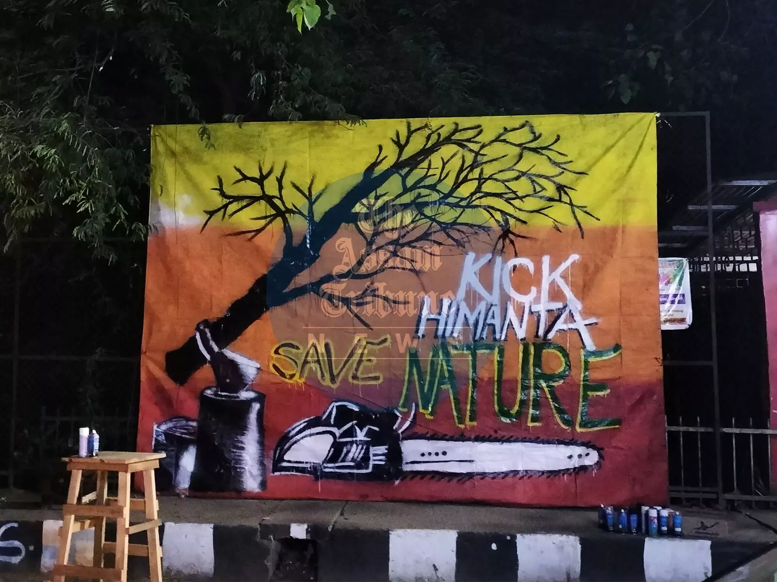 AT Photo: Artwork by Marshall Baruah against tree felling for Bharalumukh flyover