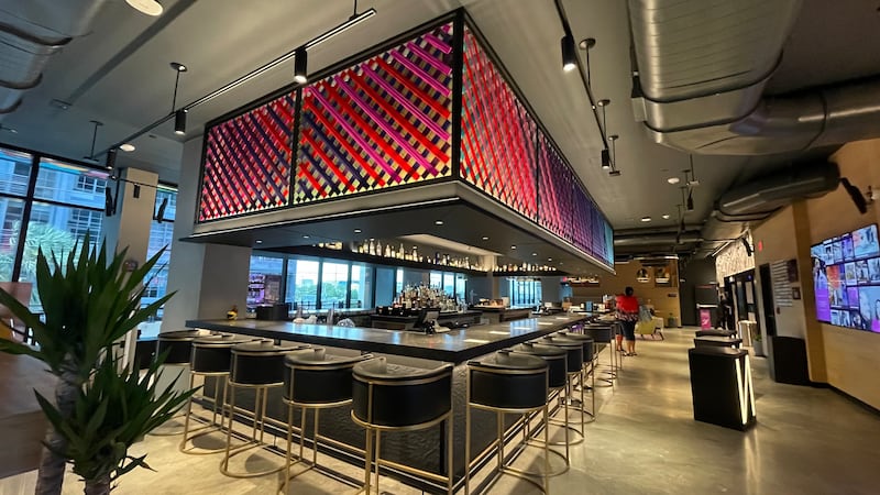 The bar which doubles as the reception desk at the Moxy Miami Wynwood hotel