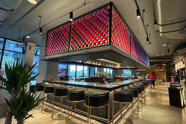 The bar which doubles as the reception desk at the Moxy Miami Wynwood hotel.