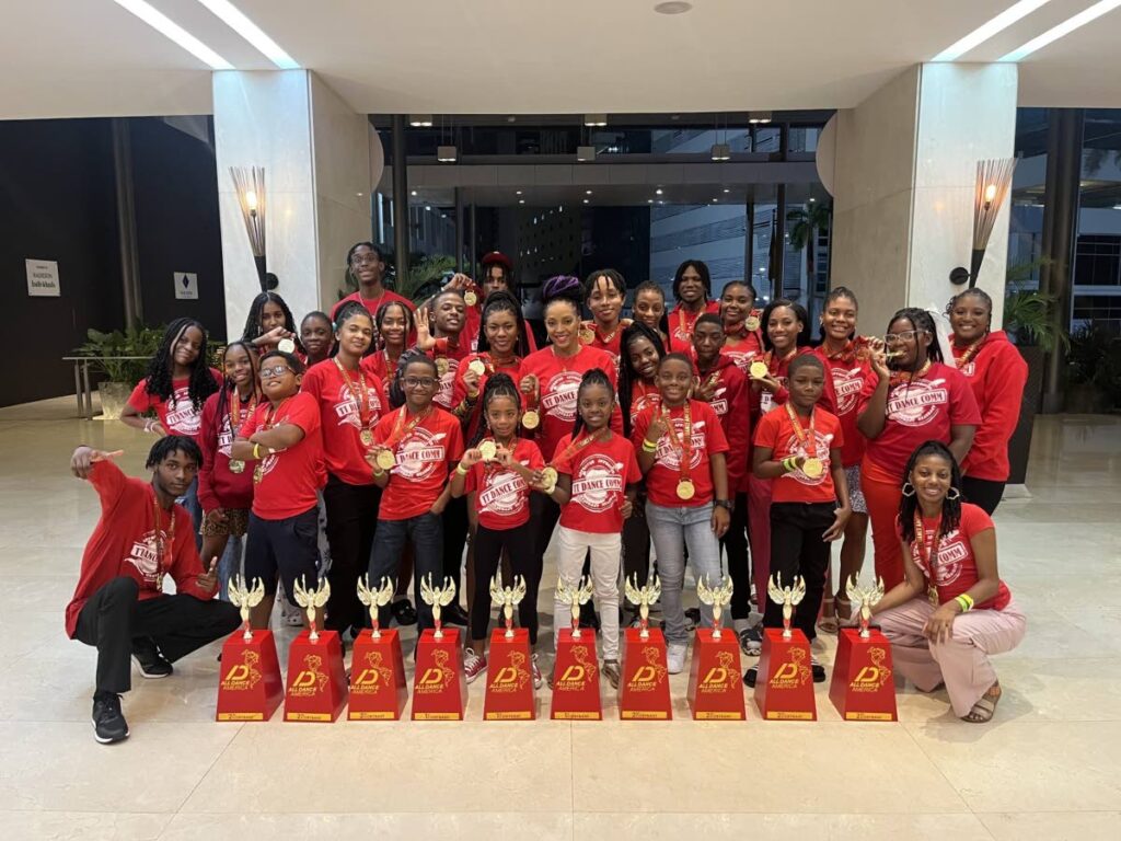 TT Dance Comm students pose with trophies they won at the All Dance America Dance competiton held in September in Panama. -